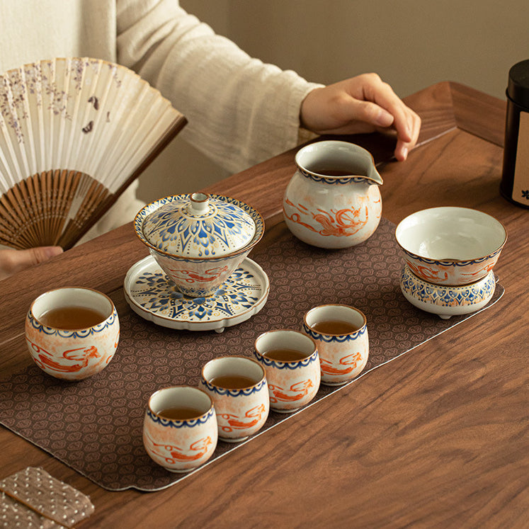 Chinese Ru Kiln ceramic tea and beverage set with painted Dunhuang Flying Apsaras patterns.