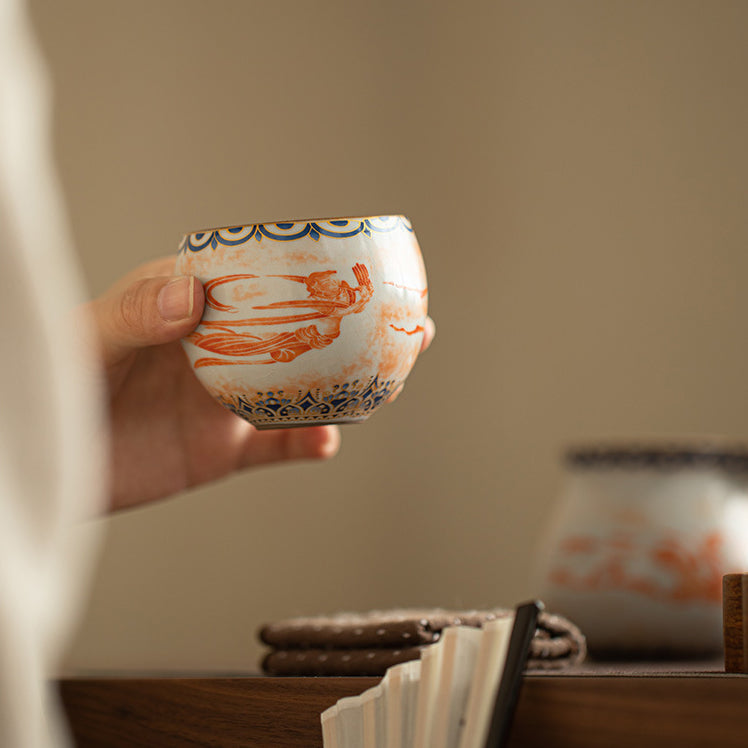 Chinese Ru Kiln ceramic tea and beverage set with painted Dunhuang Flying Apsaras patterns.